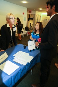 People talking at 3rd Annual Externship Expo