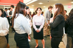 People talking at 3rd Annual Externship Expo