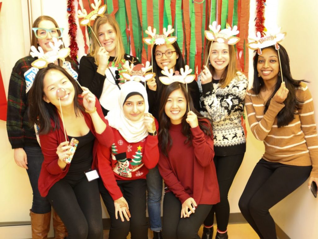 students at Optometry Holiday party with raindeer antlers