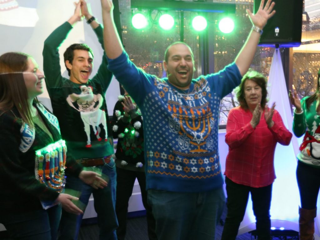 students dance at Optometry Holiday party