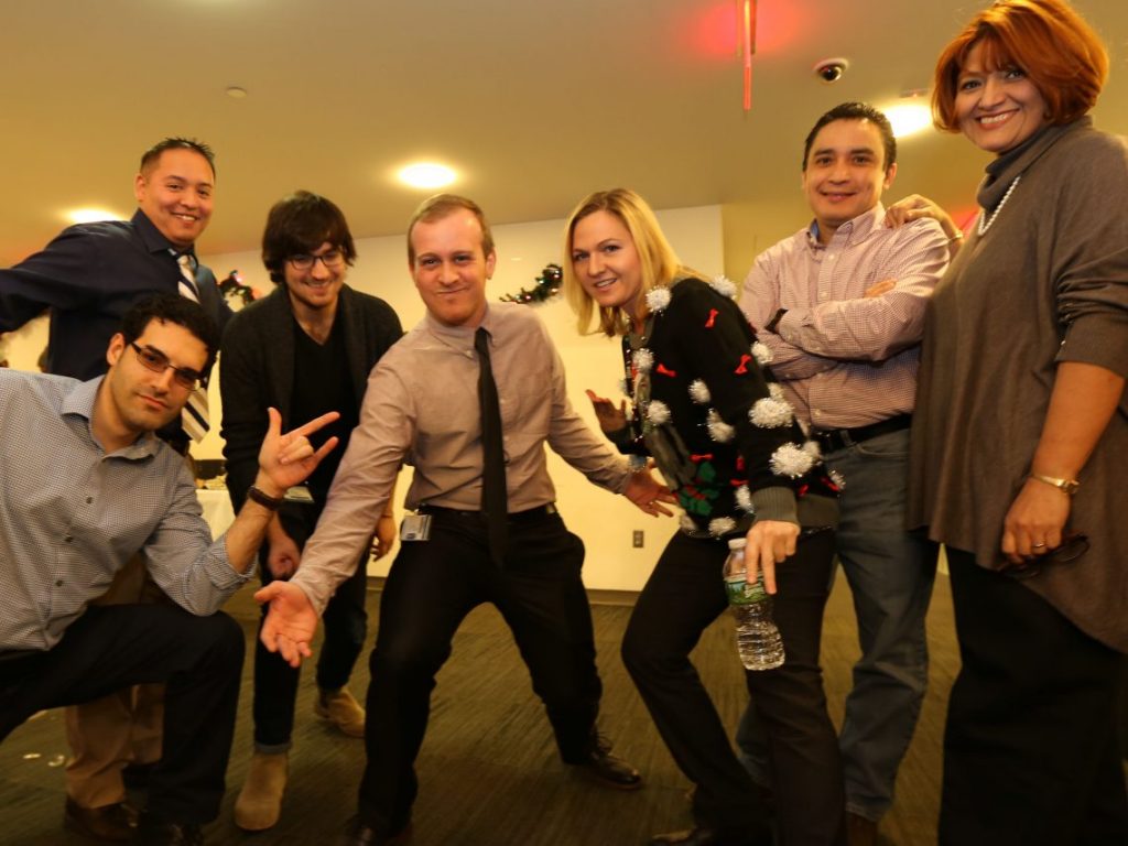 Staff pose at Optometry Holiday party