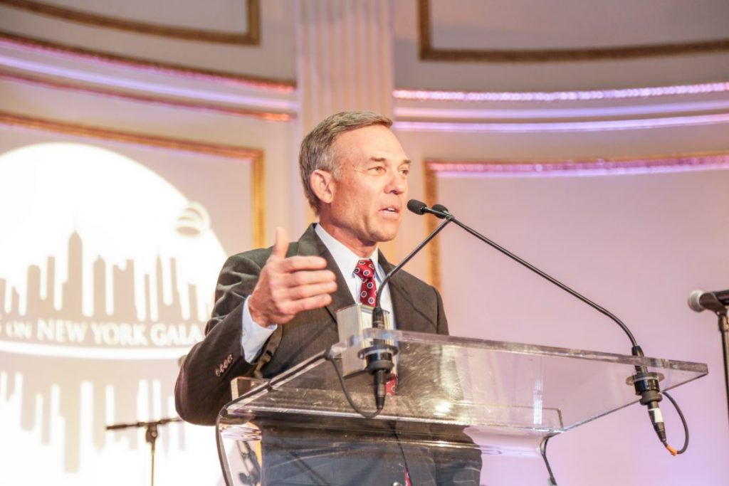 Man speaking at podium