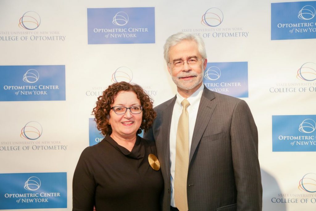 Man and woman posing at formal event