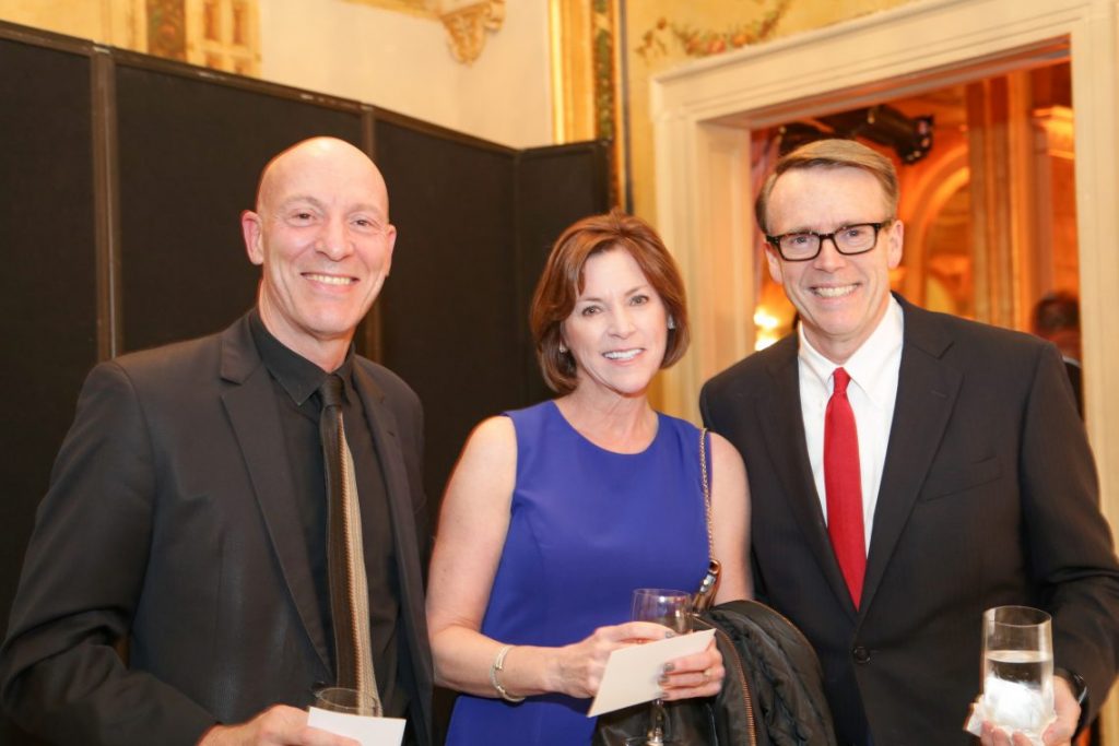 2 men and woman at formal event