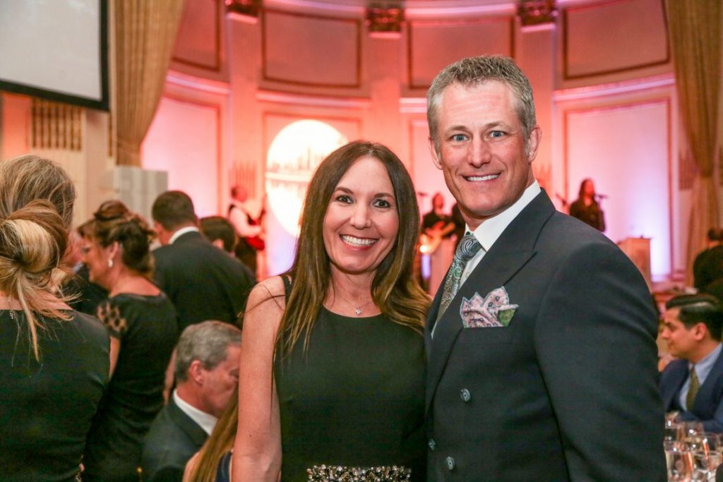 Man and woman posing at formal event