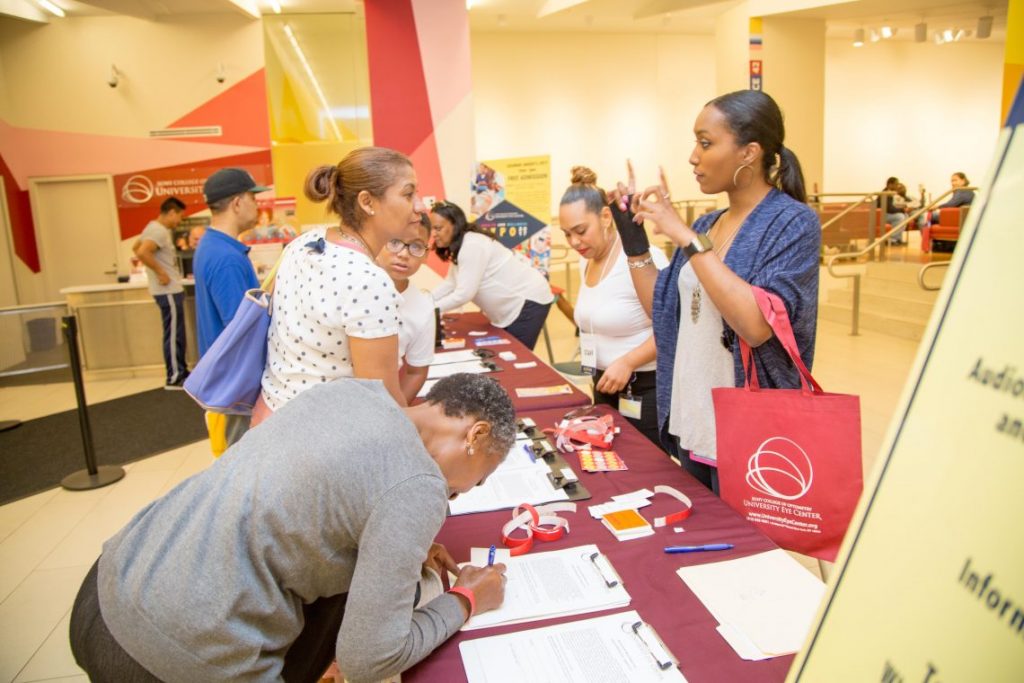 People at sign up table