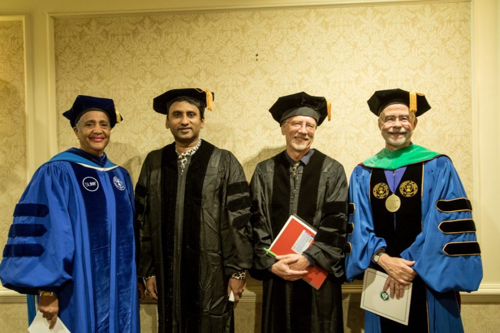 Faculty in graduation garb