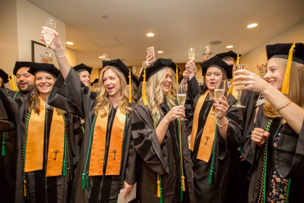 Students with graduation robes and hats