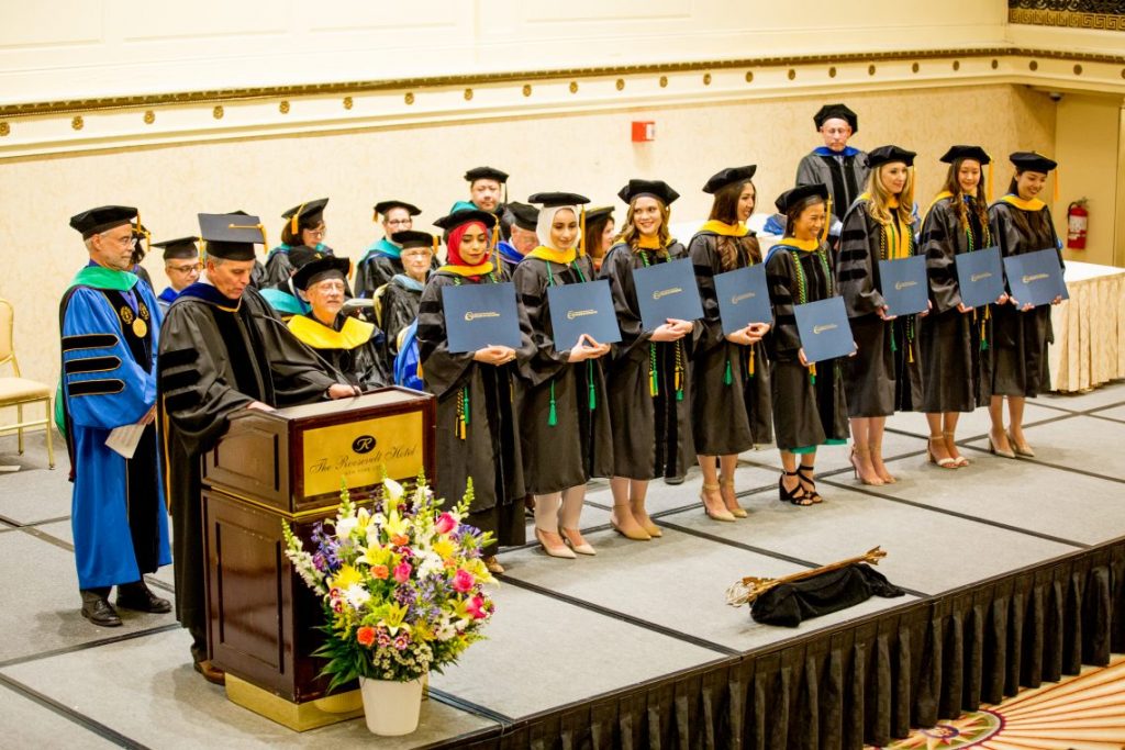 Students graduating on stage
