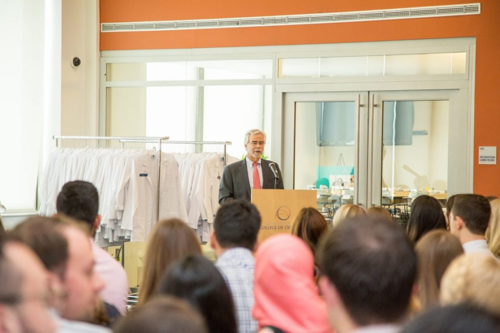 Person speaking in front of room